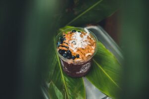 drink with blueberries and shredded coconut in macro photography / Photo by Jakob Owens on Unsplash