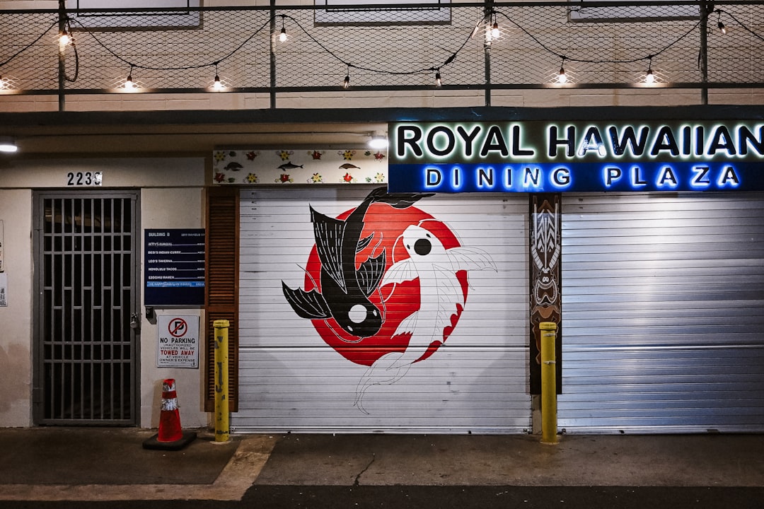Royal hawaiian dining plaza with a vibrant koi fish mural.