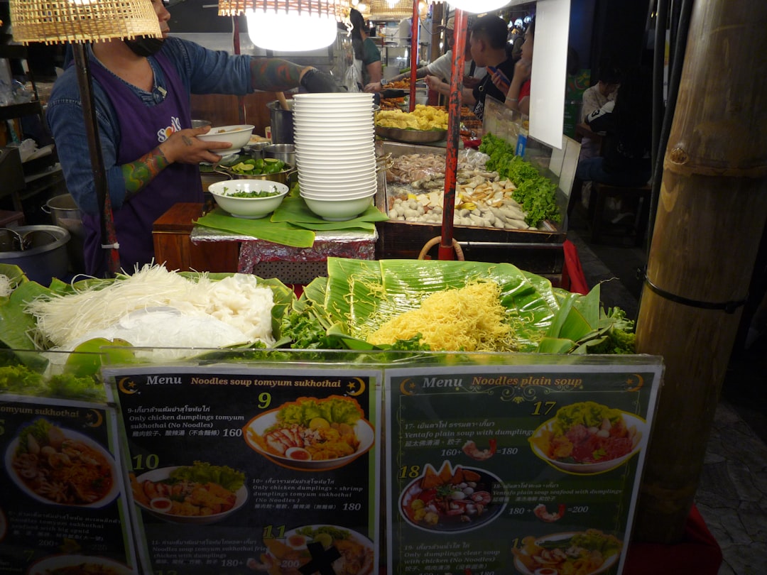 Street food vendor stall with various dishes displayed