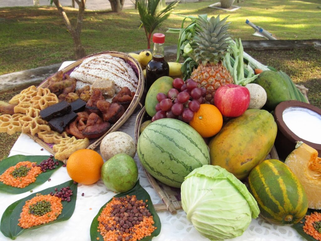 a table topped with lots of fruits and vegetables