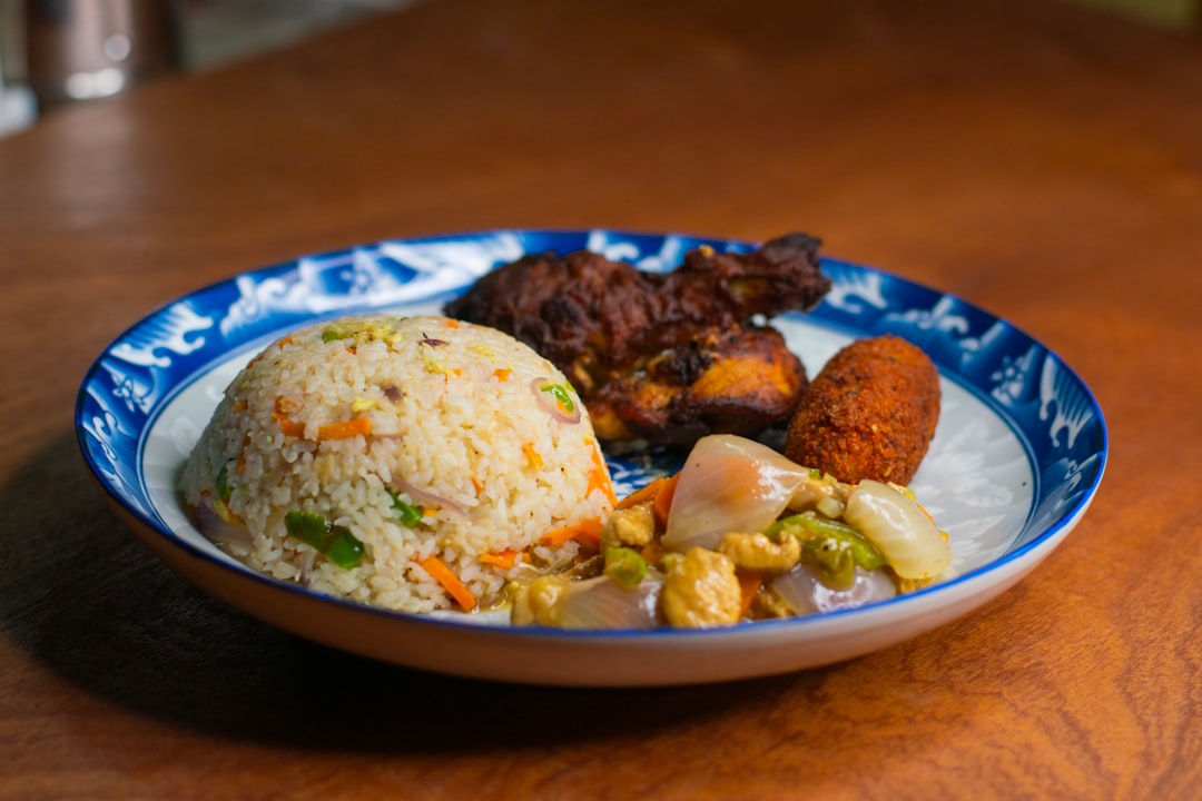 Fried rice with chicken and vegetables on plate
