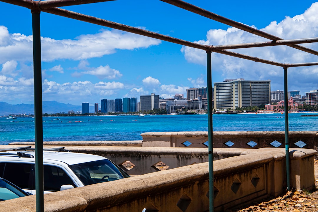 a metal frame with a city skyline in the background