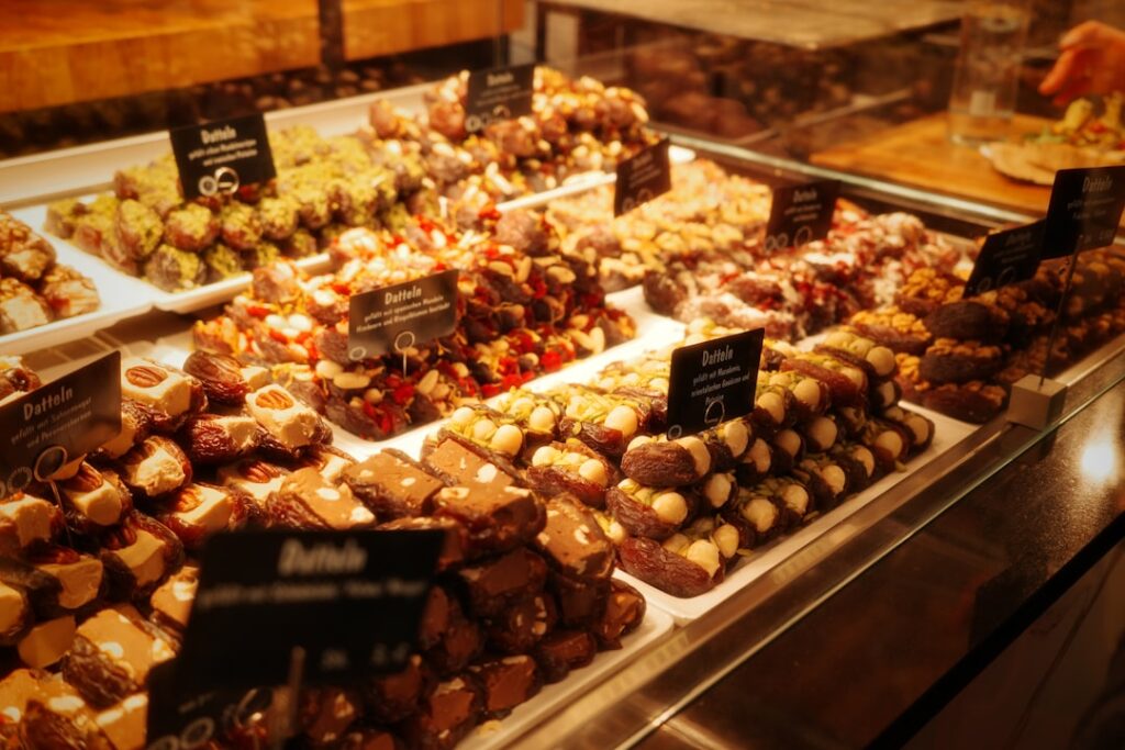 Assortment of chocolates and candies in a display case.