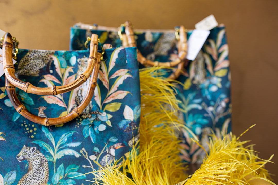 Two blue bags with yellow feathers on them
