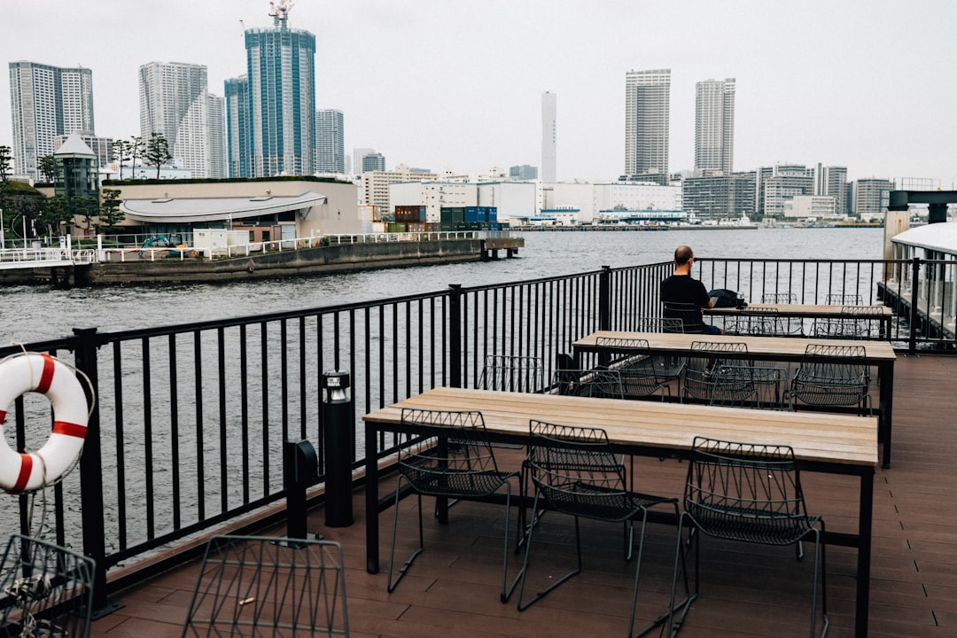 Outdoor seating area overlooking waterfront cityscape