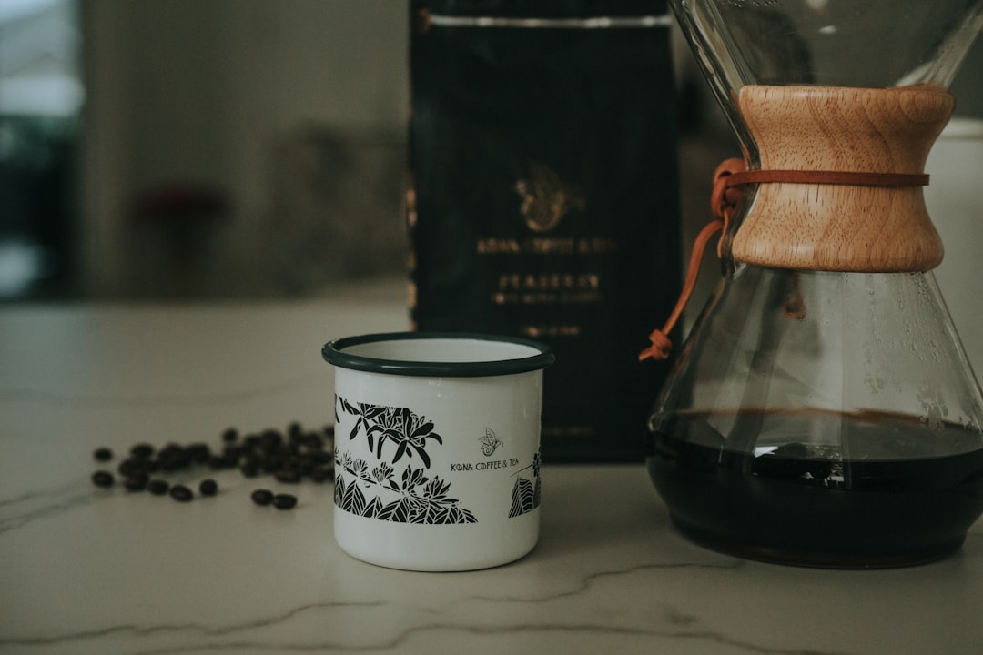Coffee beans, mug, and a coffee maker